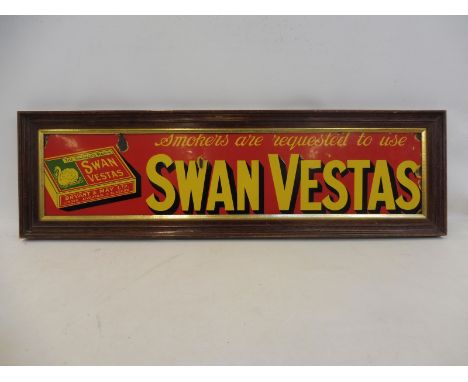A Swan Vestas pictorial packet enamel sign with good gloss, framed, 33 x 9 3/4".