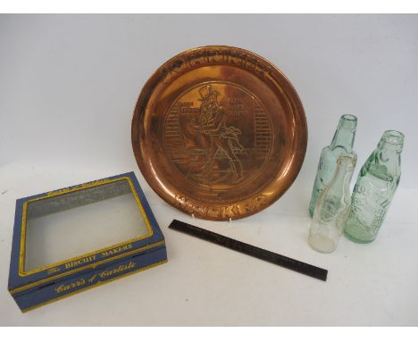 A Johnnie Walker embossed copper tray, a Carr's of Carlisle biscuit maker tin and glass lid and three glass bottles etc.