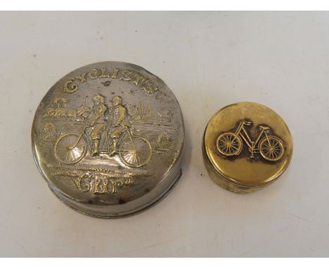 A Cyclist's silver plated concertina action travel beaker, the lid embossed with a scene of a couple on an early tandem, plus