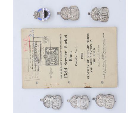 A collection of hallmarked silver ARP badges and buttonholes, an enamelled Civil Defence Instructors buttonhole and a 1940 da