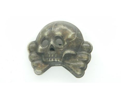 A German WWII Allgemaine pressed metal SS cap badge. UK P&amp;P Group 1 (£16+VAT for the first lot and £2+VAT for subsequent 