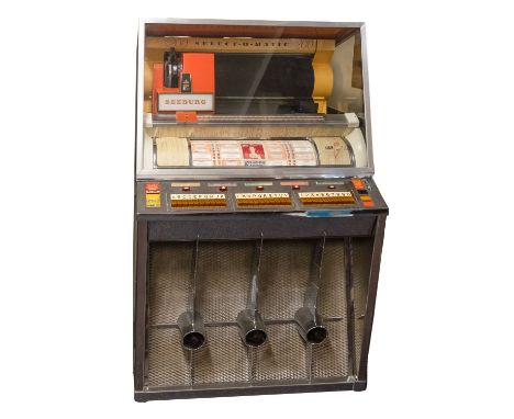 A 1957 Seeburg KS200 jukebox, vertical record stack with orange cased 'Select-O-Matic' system, with bow front rotating select