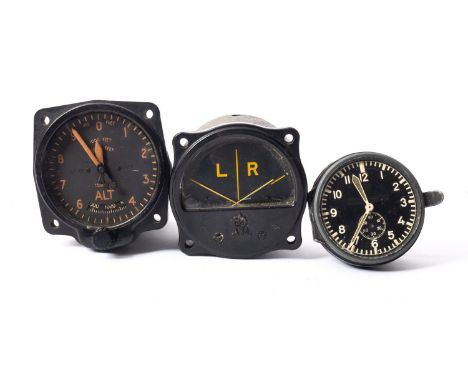A WW2 Luftwaffe cockpit clock by Junghans, the black dial with luminous hands and markers, rear of the case stamped 'J 30 E',