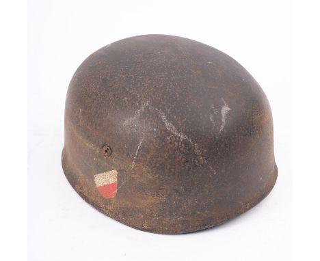 A WWII German Paratrooper's steel helmet, the exterior with remains of insignia, and interior with brown leather lining, and 