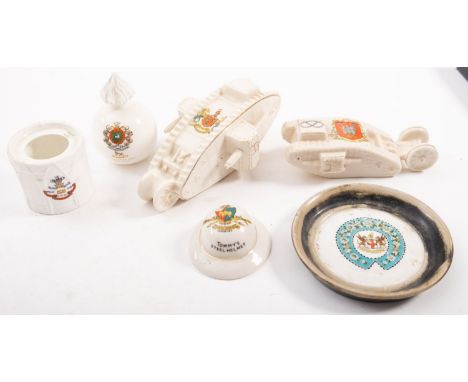 Two crested ware WWI  tanks, 'HMS Donner -Blitzen' and one other together with a grenade, a  helmet, drum and dish various ma