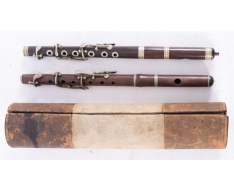A cocuswood and silver plated piccolo, maker Army and Navy Co. Society in a velvet lined black leather and suede case, 29.5cm