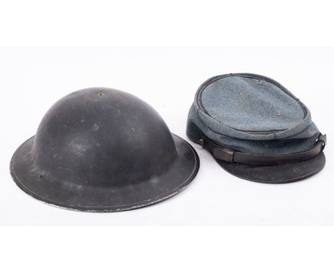 A WWII Mark II steel helmet together with a French blue cloth kepi