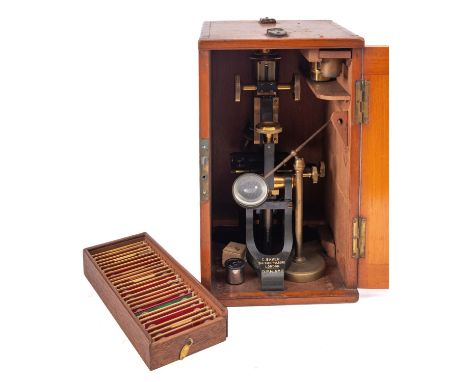 A. C. Baker London. A lacquered brass monocular microscope, rack and pinion focus with fine adjust, triple objectives over a 