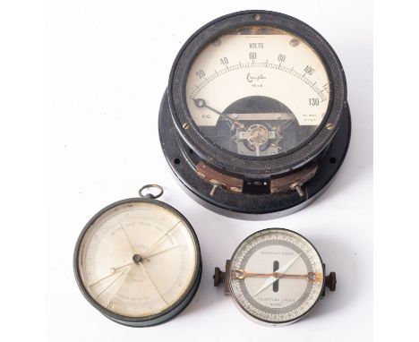 A circular aneroid barometer signed D. Lapraik, Hong Kong, together with a telegraph works resistance meter and a voltmeter.