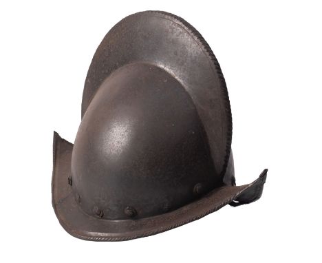 A German Comb Morion, late 16th Century, rounded one-piece skull with high roped comb, narrow downturned brim curving up to a