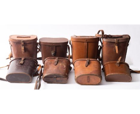 Two WW2 dated brown leather binocular cases, together with six other brown leather binocular cases