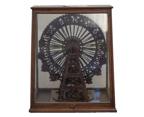 A late 19th/early 20th century scratch built scale wooden model of a Ferris wheel, the 15 1/12 inch fretwork double frame whe