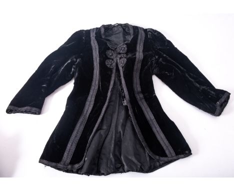 A late Victorian early Edwardian black silk and lace blouse, together with a black silk and beadwork bodice, and a child's ba
