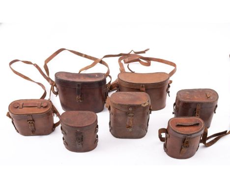 Seven various early 20th century brown leather binocular cases