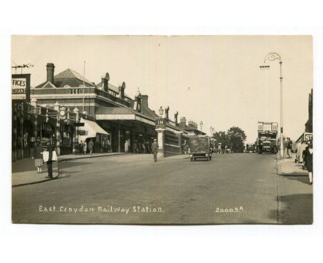 A collection of 16 postcards of railway stations in the London area, including photographic postcards titled 'Wimbledon Stati