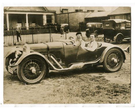 ASTON MARTIN. A sepia toned photograph of the music hall duo Nervo &amp; Knox in an Aston Martin, dated 12th Feb. 1932 to the