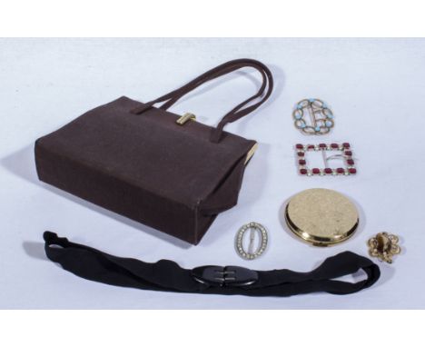 A vintage handbag, four buckles and a compact