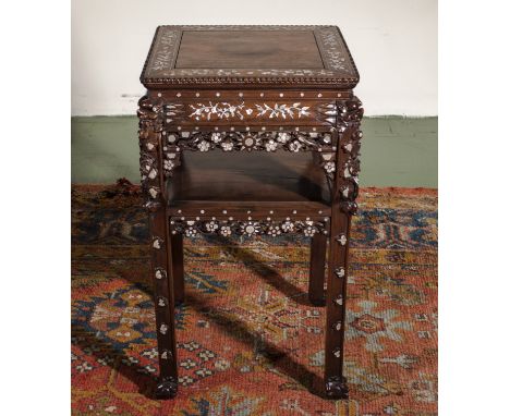 A Chinese hardwood stand profusely inlaid with mother of pearl, height 81cm, top 44cm square