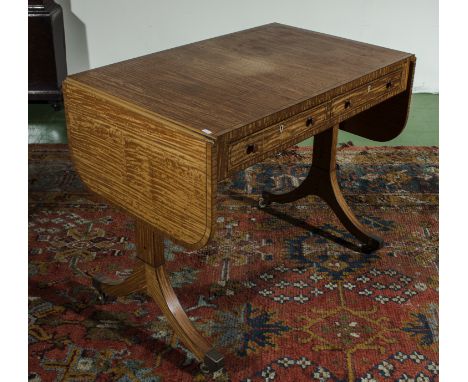 A Victorian satin wood sofa table on sabre legs