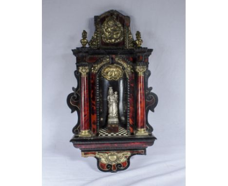 17/18th century Baroc tortoiseshell wall tabernacle with a silver Madonna and child to the niche. Corinthian column sides wit