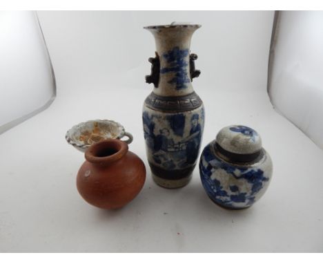 A Chinese blue and white twin handled vase, together with a Chinese blue and white ginger jar and two other ceramic items. 