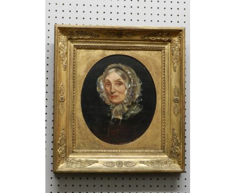 Late 19th/ early 20th century British School, portrait of a lady, oil on board, unsigned, inscription to verso 'Mrs Alcock, M