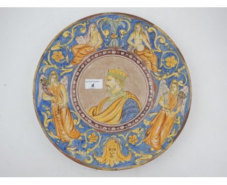 A 19th century Italian majolica charger, centered with a profile portrait of a King, within foliate and figural reserves.