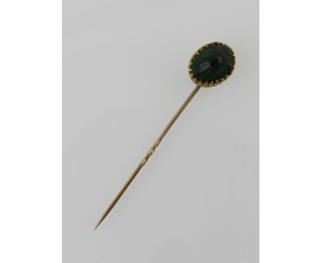 An early 20th century yellow metal scarab beetle tie pin.