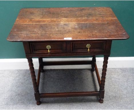 A made-up 17th century and later oak side table, the single frieze drawer on bobbin turned supports, united by perimeter stre