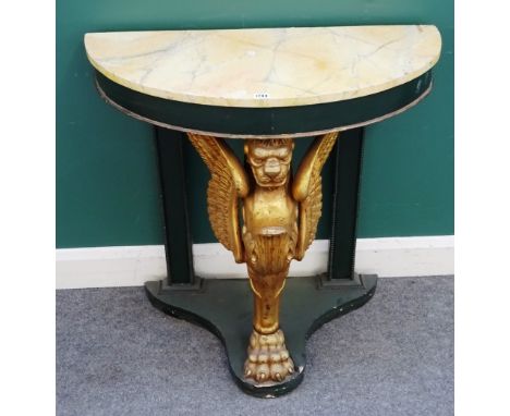 A 20th century console table, the semi-elliptic faux marble top on a gilded winged monopodia support, 87cm wide x 84cm high x