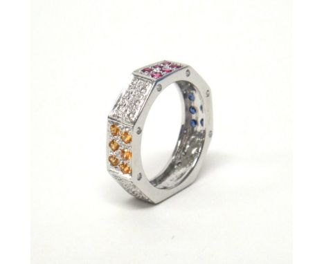 An 18ct white gold, diamond, sapphire, ruby and yellow gem set ring, in an octagonal design, having diamond set sides to the 