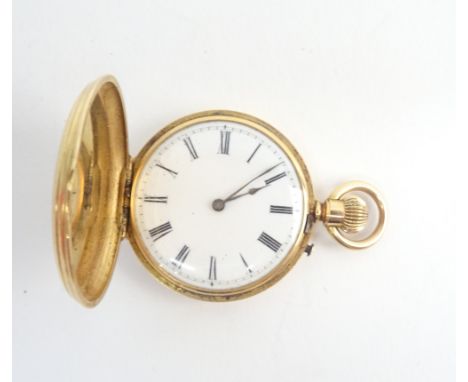 A lady's gold cased, keyless wind, hunting cased fob watch, with an unsigned gilt jewelled cylinder movement, the enamelled d