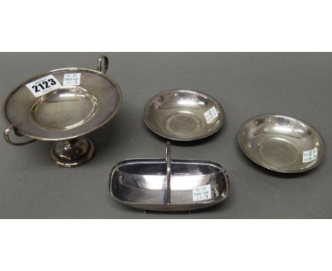 Silver and silver mounted wares, comprising; a twin handled pedestal dish, Birmingham 1904, a trinket dish, formed as a garde