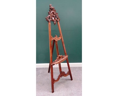 A North Italian walnut 'A' framed easel, with scroll carved crest, 67cm wide at the base.