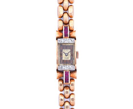 A lady's gold, diamond and synthetic ruby set dress bracelet wristwatch, circa 1940, the two tone rectangular dial detailed A