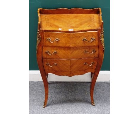 A Louis XV style gilt metal mounted marquetry inlaid walnut bombe three drawer commode, on cabriole supports, 58cm wide x 83c
