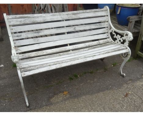 A 20th century white painted metal and wooden garden bench, 130cm wide. 