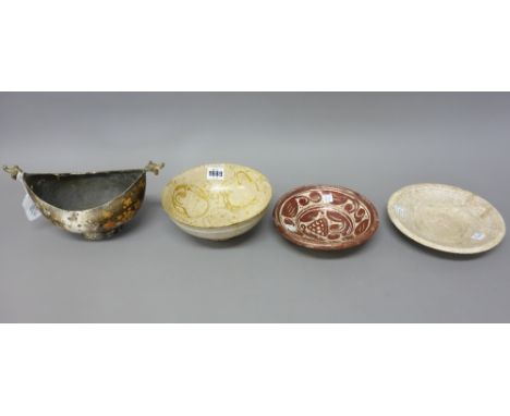 A Kashan lustre bowl, probably 13th century, painted in golden lustre with four portrait panels, (a.f), 19cm. diameter; also 