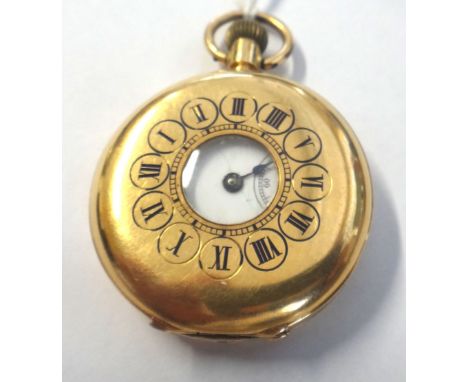 A lady's gold cased, keyless wind, half hunting cased fob watch, with a gilt jewelled lever movement, the inner and outer cas