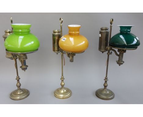 An Edwardian brass oil lamp (converted), the label detailed 'Salon & Co, London & Edinburgh', with loop handle, glass shade a
