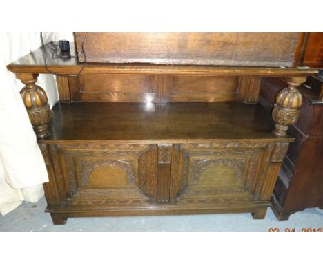 An early 20th century oak two tier buffet, on bulbous turned upright supports and block feet, 127cm wide x 92cm high.