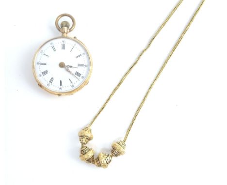 A gold cased, keyless wind, openfaced lady's fob watch, with an unsigned gilt cylinder movement, base metal inner case, the e