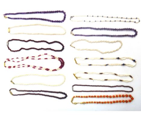 Two single row necklaces of amethyst quartz beads, three single row necklaces of garnet beads, a single row necklace of seed 