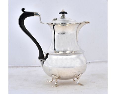 A silver four piece tea set, comprising; a teapot, a hot water jug, a twin handled sugar bowl and a milk jug, each piece havi
