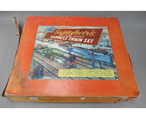 Collectable toys, comprising; a Mettoy 'Satetylectic' O gauge express train set, a Trix twin railway train set and accessorie