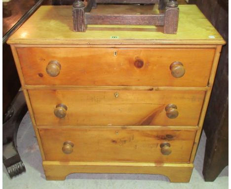An early 20th century pine chest of three long drawers, on bracket feet with bun handles, 77cm wide x 80cm high. 