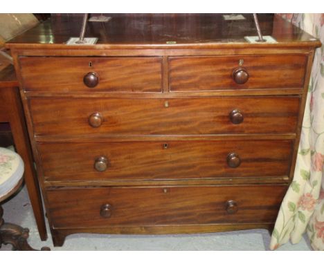 A Victorian mahogany chest of two short and three long drawers, with bun handles on bracket feet, 102cm wide x 91cm high.