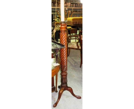 A Victorian mahogany spiral twist standard lamp, on three downswept cabriole supports, 175cm high, together with another on a