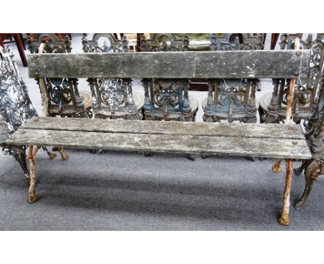 A 19th century garden bench, with wooden plank back and seat, on white painted cast iron naturalistic supports, 167cm wide x 