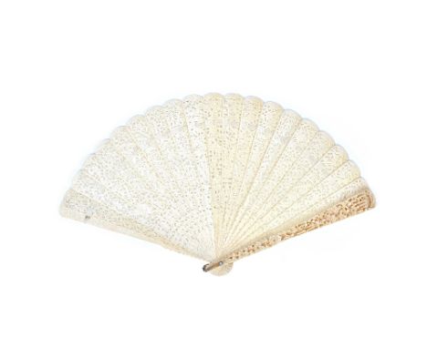 A Cantonese ivory brisé fan, circa 1900, ornately carved and pierced with figures against a landscape, the stick guard 23.5cm